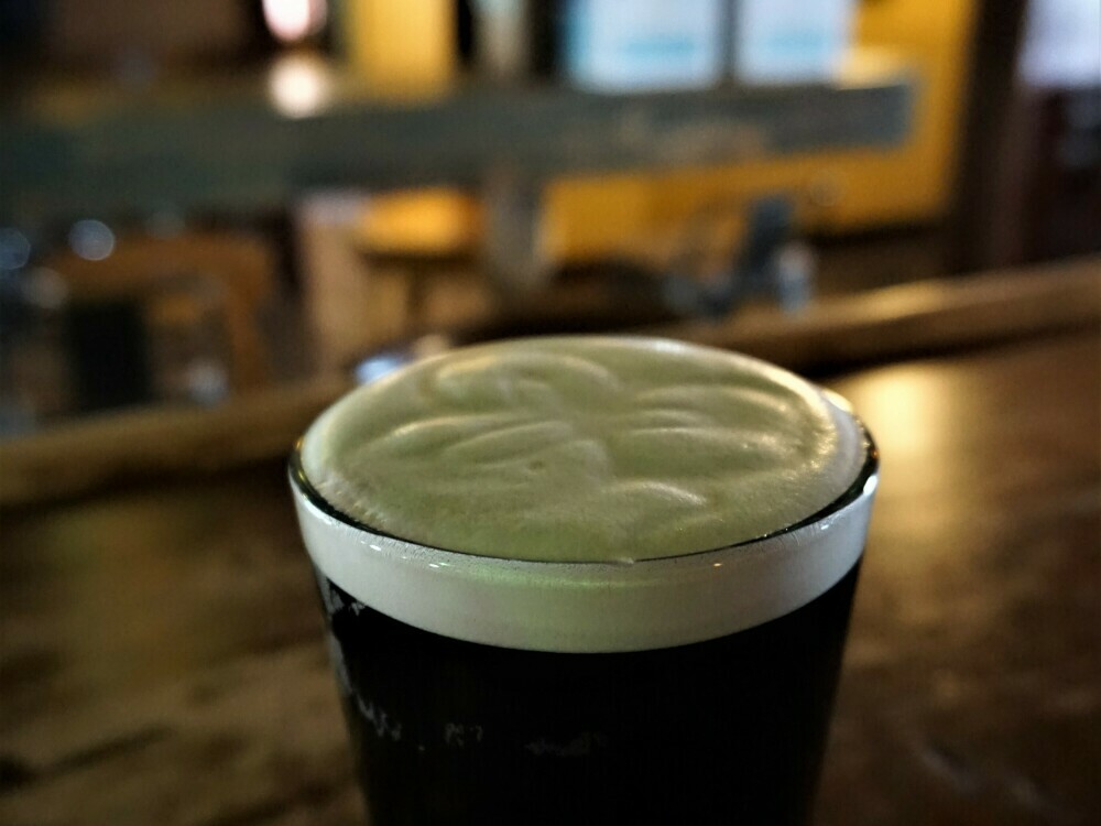 The perfect pour, complete with Flanagan's signature clover.